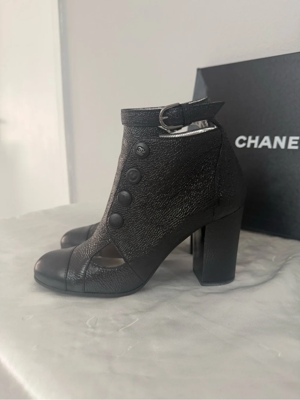 CHANEL Black Leather Cutout Button Ankle Boots